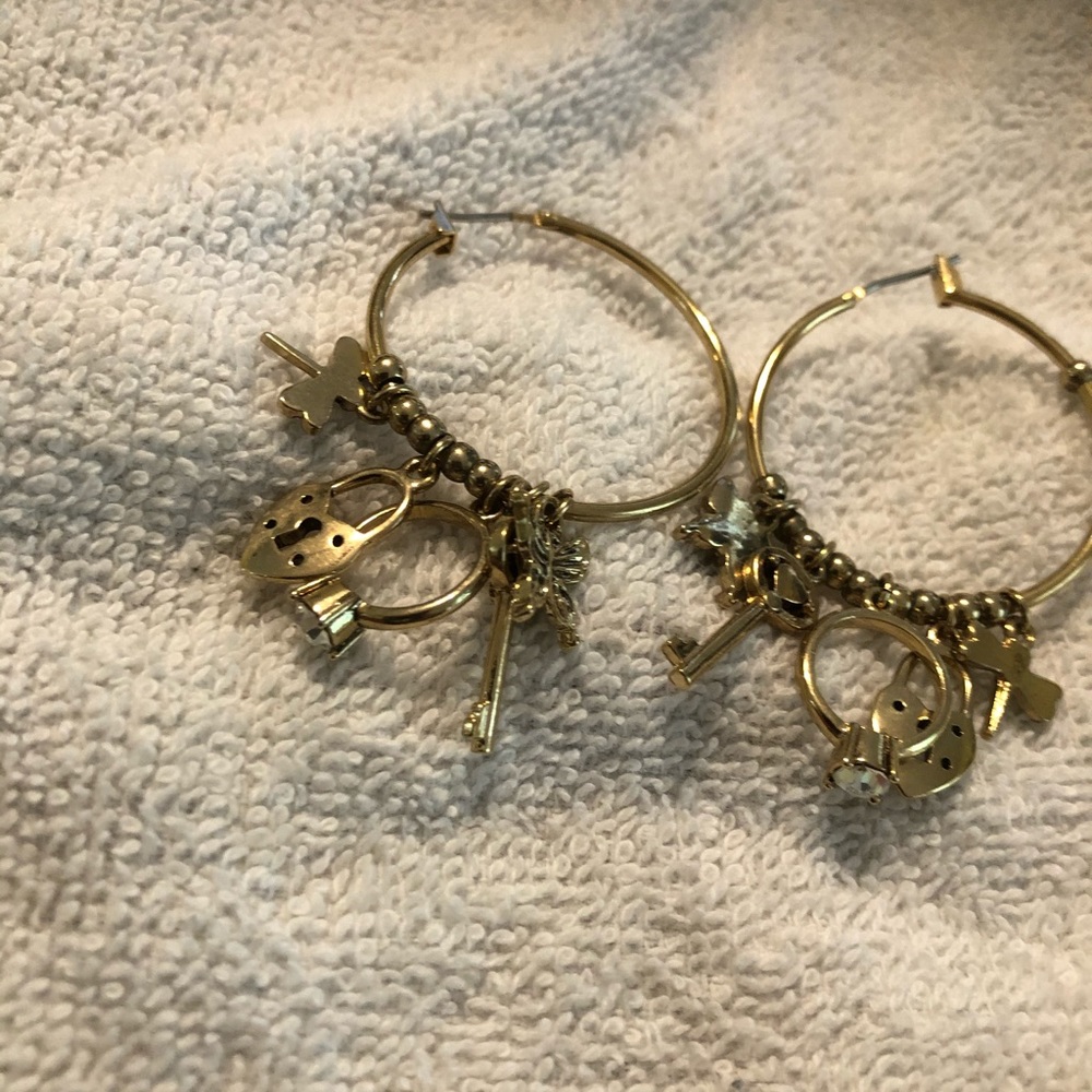 Hoop gold tone earrings with charms